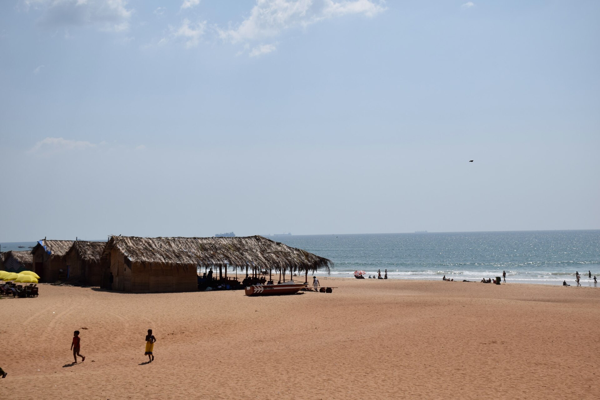 Broad sweeping golden sand coastline and Arabian Sea waves at Calangute Beach in North Goa