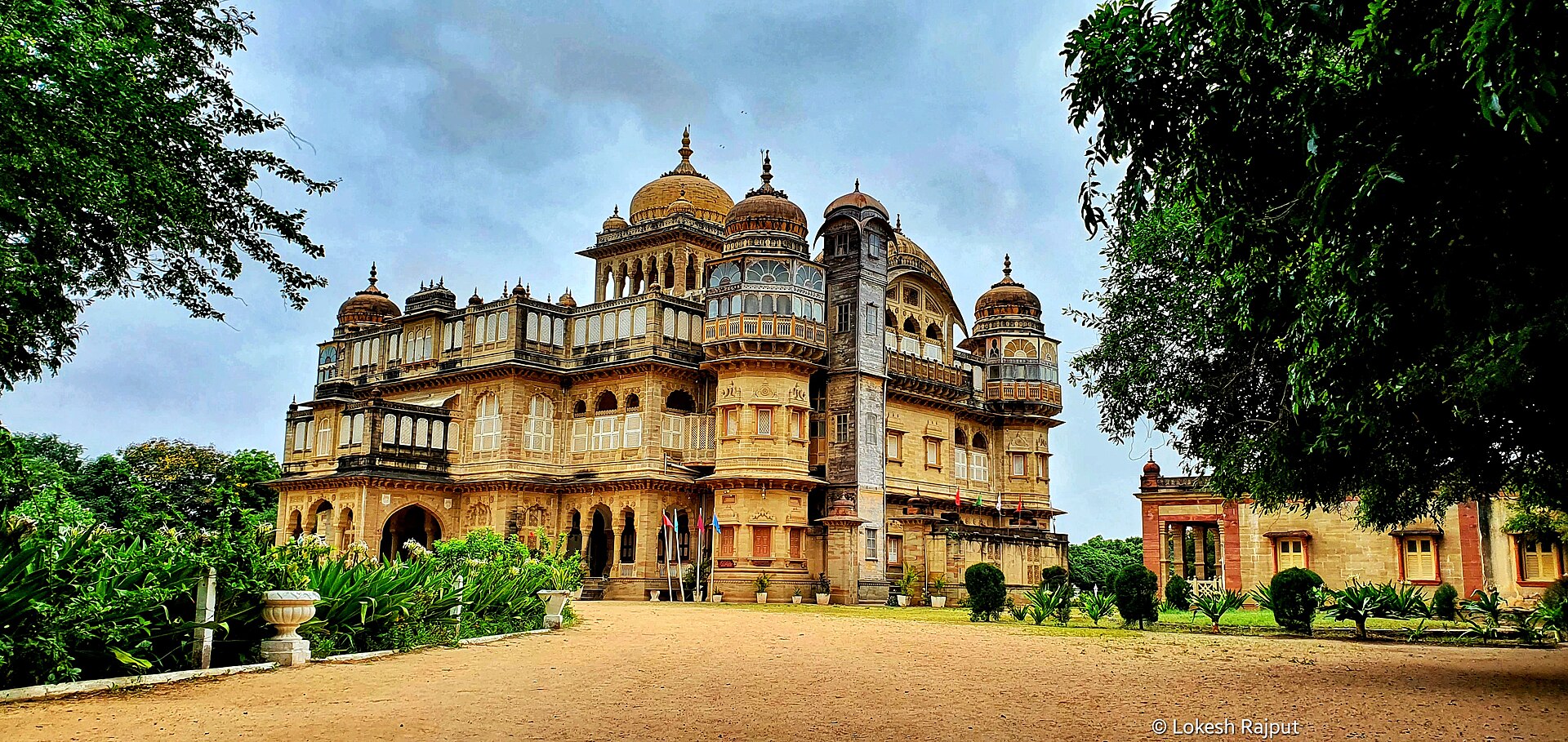 Magnificent red sandstone domes and chhatris of Vijay Vilas Palace overlooking the private beach in Mandvi, Kutch