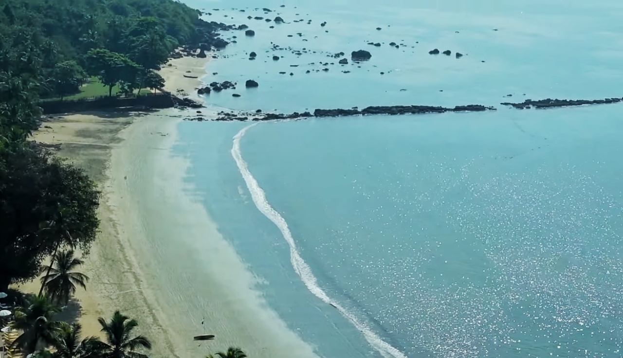 Broad golden sandy beach, camel rides, and breaking Arabian Sea waves at Panambur Beach in Mangalore